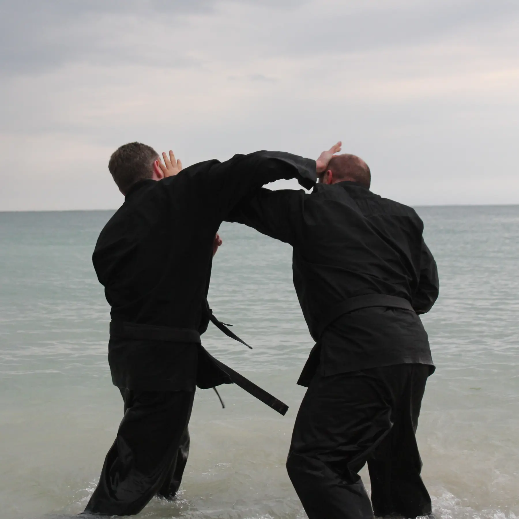 Olgun sparring in water with John Wetherell Sensei [4th Dan Karate & Black Sash Wing Chun Kung Fu]